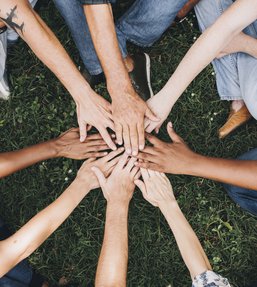 Diverse group of hands in circle.jpg