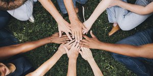Diverse group of hands in circle.jpg